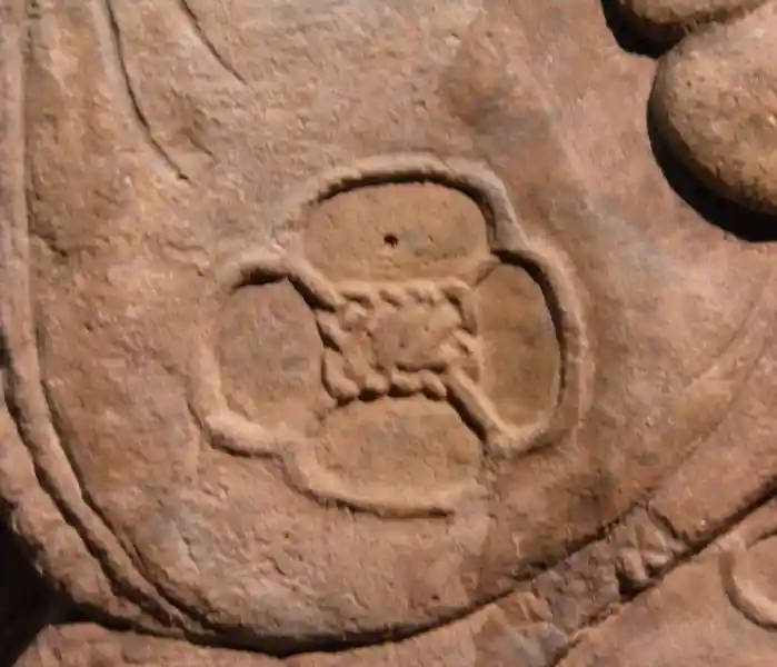 A flower-like cross on a Mayan lintel